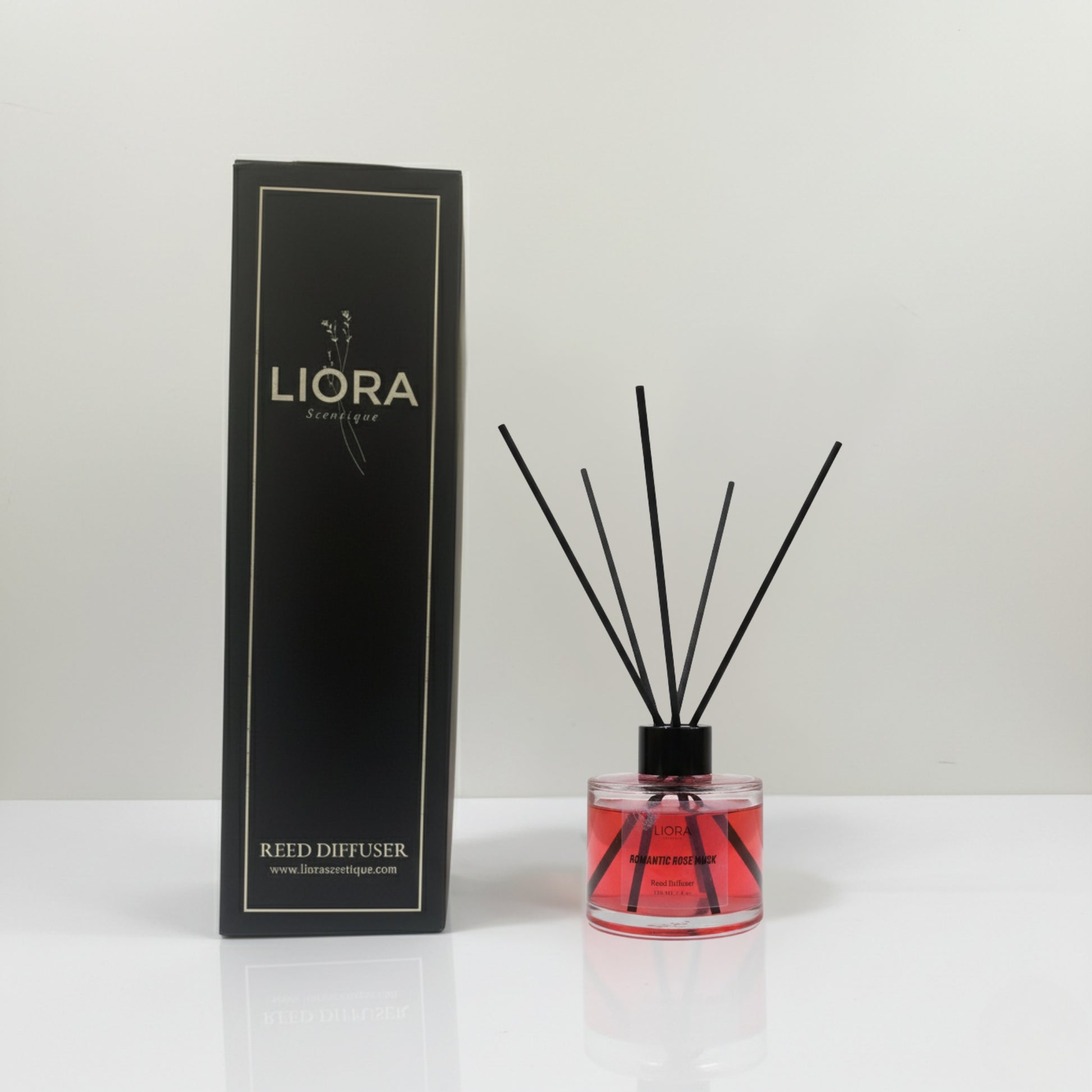 Liora reed diffuser with packaging on a white background